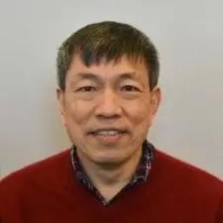 Peter Ling smiling and wearing a red shirt