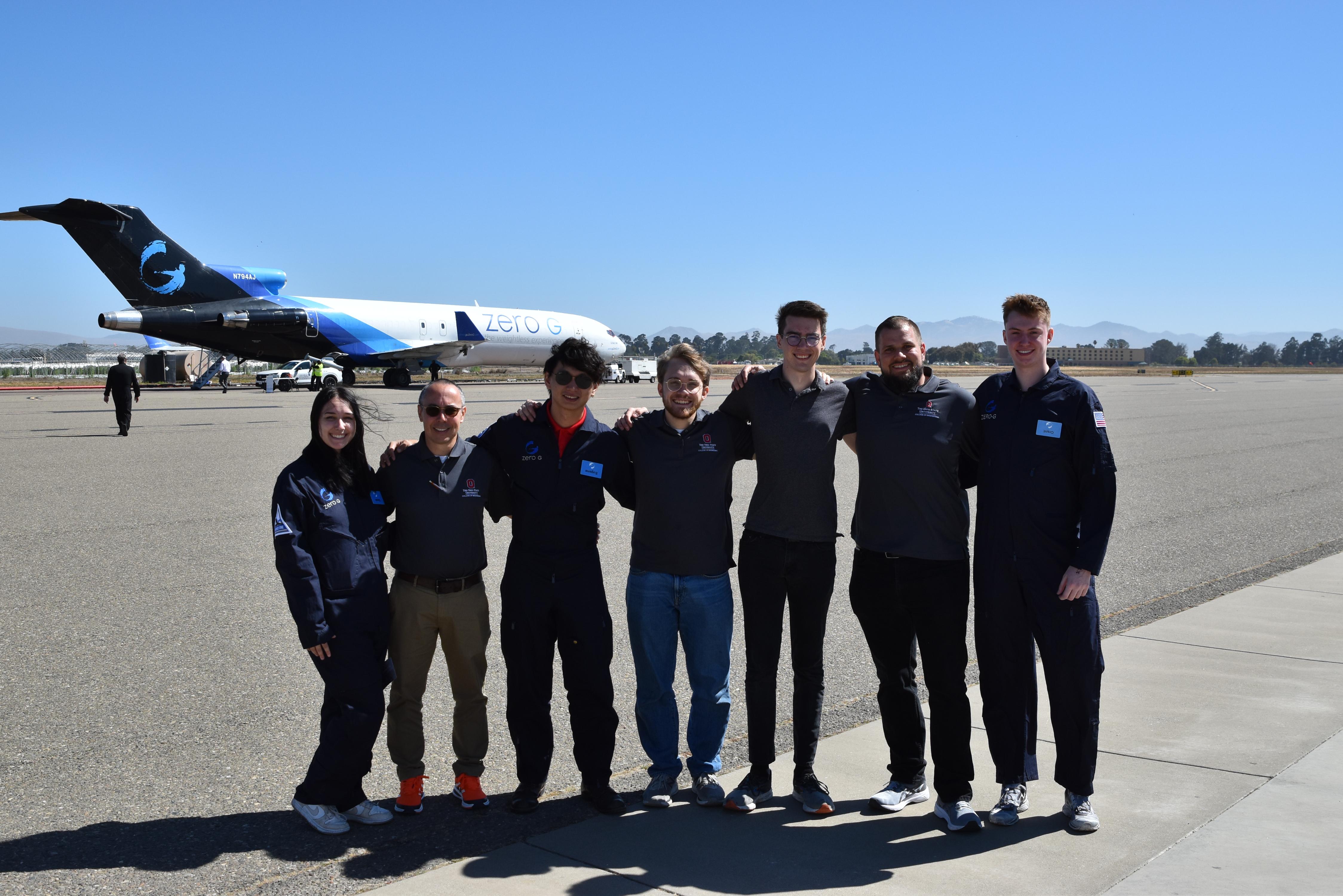 students and faculty in front of airplane to test parabolic flight