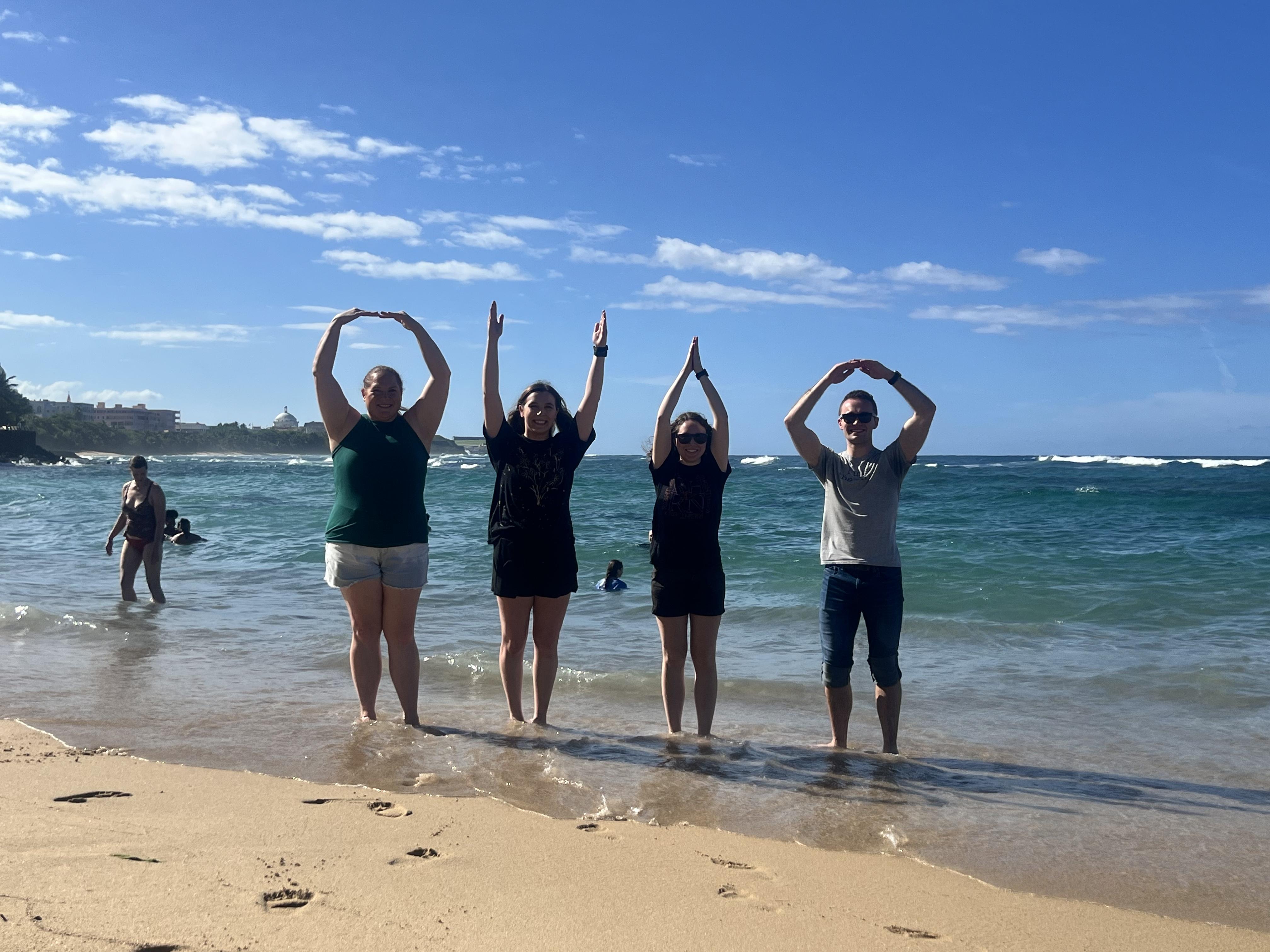 students and staff on the beach in puerto rico