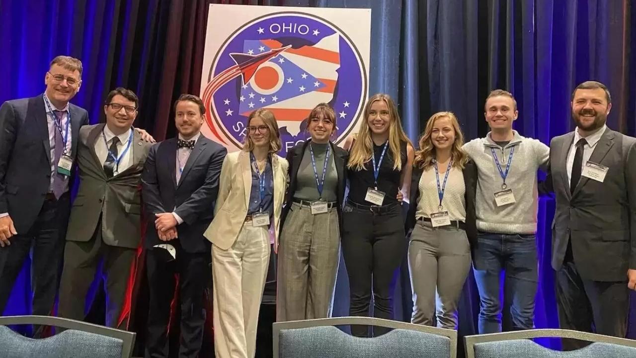 Group of people standing on a stage